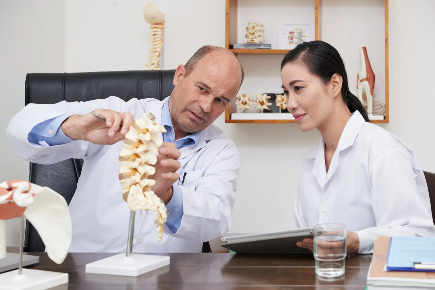 A sciatica chiropractor explaining spine problem